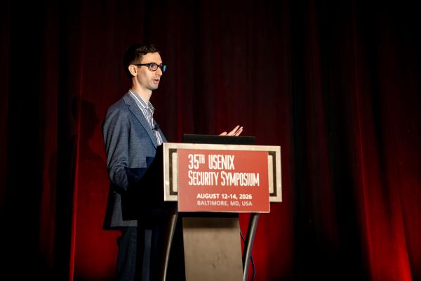 Stefano Trevisani presenting at the 35th USENIX Security Symposium in Baltimore, August 2026